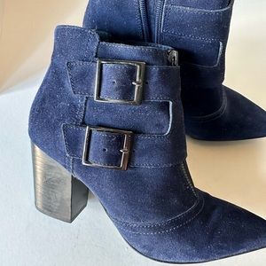 Restricted navy suede 3” heel booties, pointed toes, and side zip.